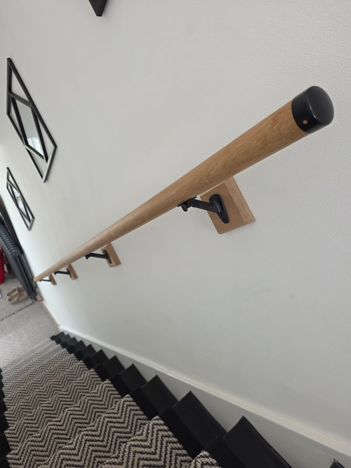 Additional finished view of an Elite staircase renovation and hallway project
