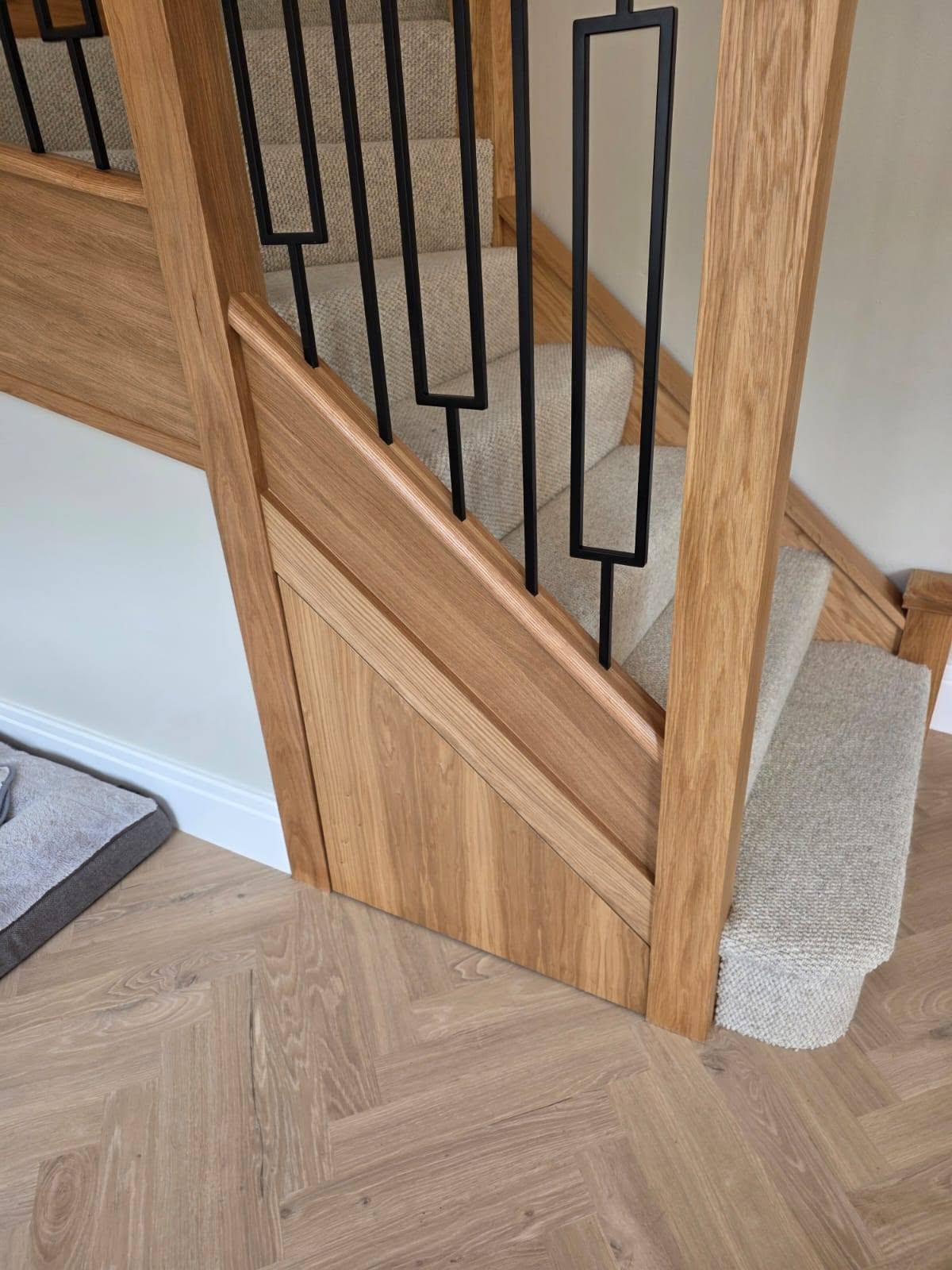 Custom understairs storage installation by Elite in a customer home